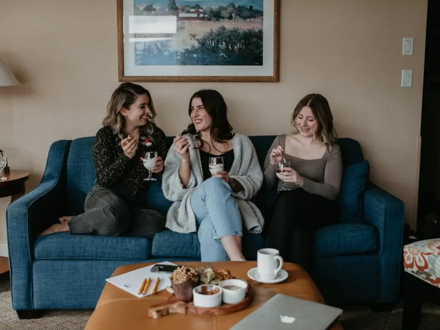 Friends sharing dessert in a suite
